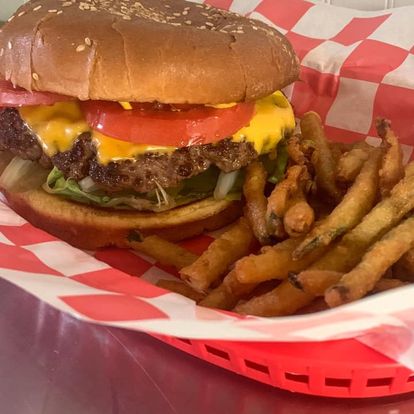 Burger and fries in red basket from Hitchin Post 55 in Bremen, GA