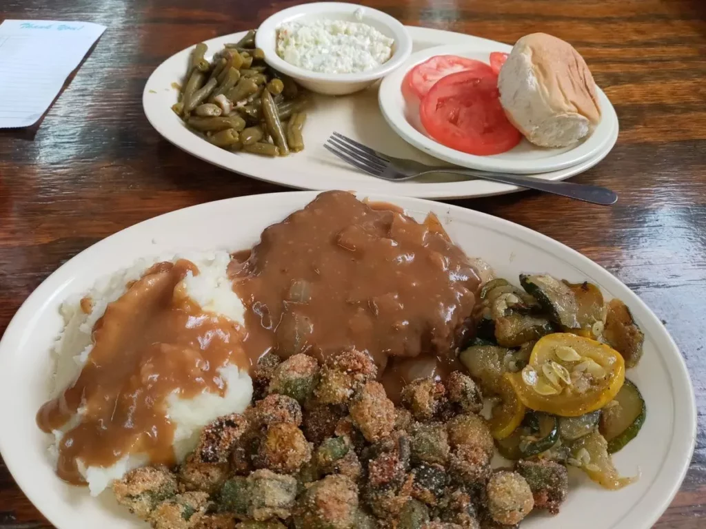 Two plates of southern cooking food from Grandmas Kitchen in Bremen, GA